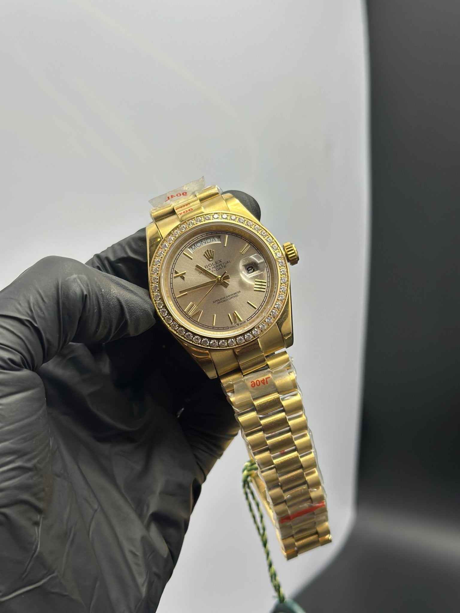 Rolex Daydate 40mm Gold Presidential Bracelet Stonned Bezel Grey Roman Dial White Stoned Bezel – men’s watch